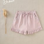 Short malva con bordado en los bolsillos laterales